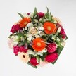 A symphony of textures and colours, this bouquet celebrates Mitcham's happiest moments with exuberant flair. At its vibrant heart, orange gerberas surge forward, petals catching the light with a festive glow. Plush magenta carnations and layers of blush roses unfurl alongside, creating a tapestry so lush and inviting it draws you irresistibly closer. Mingled with snowy alstroemeria and clusters of petite white daisies, the design feels as fresh as a walk through one of Mitcham's blossoming parks after rain. Glossy greenery surrounds each flower, showcasing the abundance that defines the area's gardens and the attention to detail typical of a local florist. Scented with a gentle sweetness, the bouquet radiates joy, optimism, and artistry-its harmonious palette echoing the gentle resurgence of springtime on local streets. Ideal for celebrating birthdays, anniversaries, or sending a caring message across Mitcham, this bouquet embodies the enduring charm of flowers gathered with love right in the heart of the community.